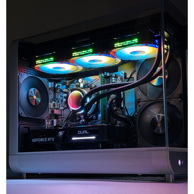Glossy computer case with colorful lighting and visible components on a dark background